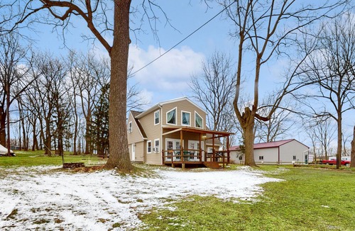 Cayuga House | Lake-view retreat with dock access, firepits, & large yard