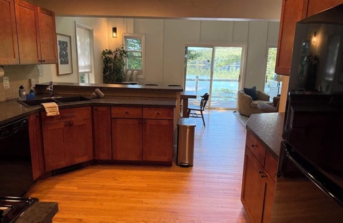Plymouth House | Lakefront 4BR3BA modern retreat with private dock, kayaks, firepit plus dogs OK