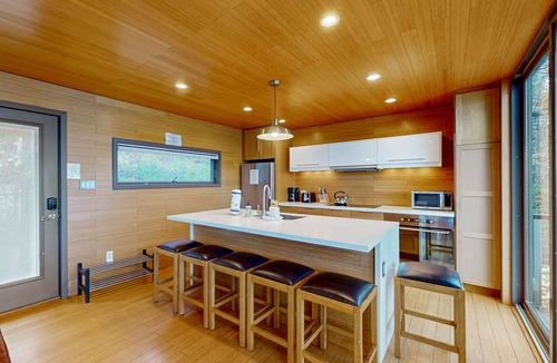 Valois House | Lakefront contemporary gem with decks, lake views & pebble beach