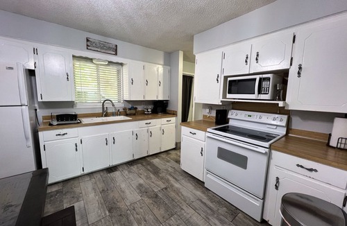 Rogers Cottage | Lakefront family friendly Chalet with fire pit and use of kayaks and canoe.