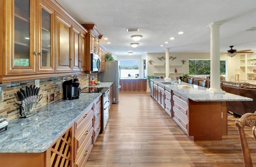 Seffner Community Alliance House | Lakefront Getaway - Luxurious Home - Pool & Games