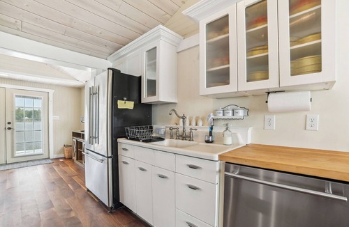 Gladwin Cottage | Lakefront Gladwin Vacation Rental w/Deck & Dock!