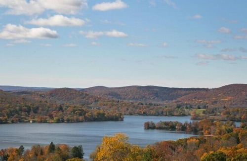 New Preston House | Lakefront Home set on five acres of land, deck, patio, lounge seating by...