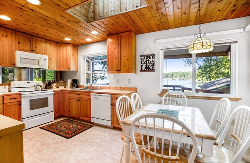 Grapeview House | Lakefront home with beach access, a firepit, washer/dryer & fireplace