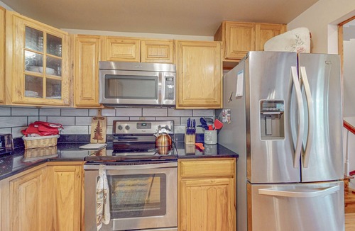 Arbor Vitae House | Lakefront home with large patio, fire pit, W/D & WIFI