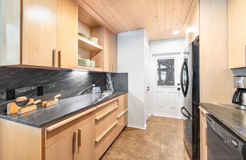 Tool House | Lakefront home with luxury touches. Ample outdoor space for making memories.