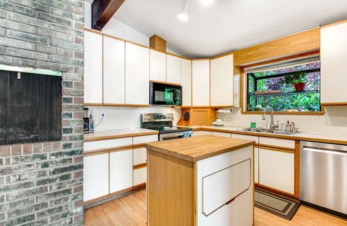 East Olympia House | Lakefront home with private dock, paddleboat, fast WiFi, deck, grill & W/D