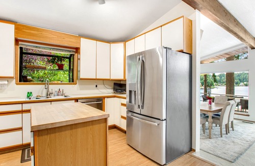 East Olympia House | Lakefront home with private dock, paddleboat, fast WiFi, deck, grill & W/D