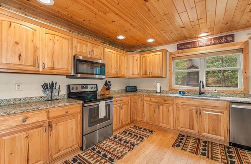 Eagle River House | Lakefront home with private dock, firepit, playground & lake views