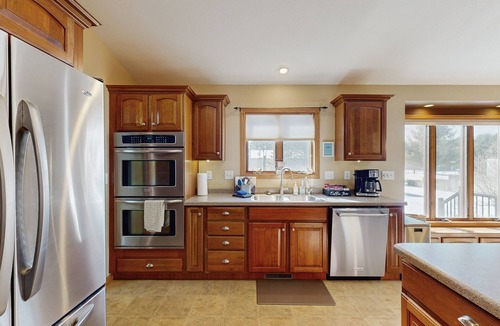 Friendship House | Lakefront home with grill, firepit, pool table, & jetted tub