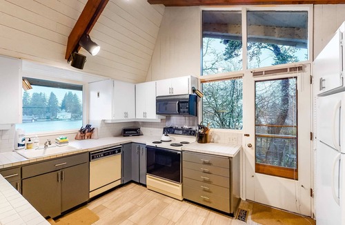 Otis House | Lakefront house with private dock firepit and sunset views