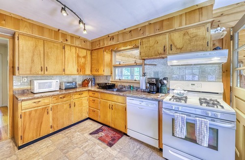 Brant Lake House | Lakefront house with 275' of waterfront, enclosed porch, & firepit
