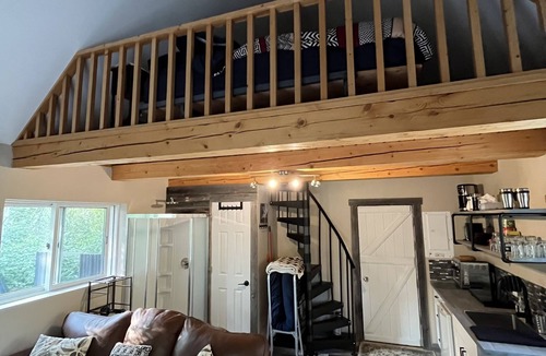 Onanole Cottage | Lakefront Log Cabin with HOT TUB. Unique property with private lake access.