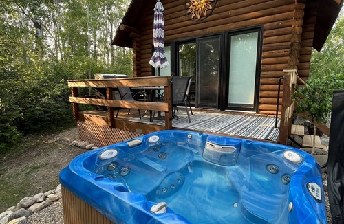 Onanole Cottage | Lakefront Log Cabin with HOT TUB. Unique property with private lake access.