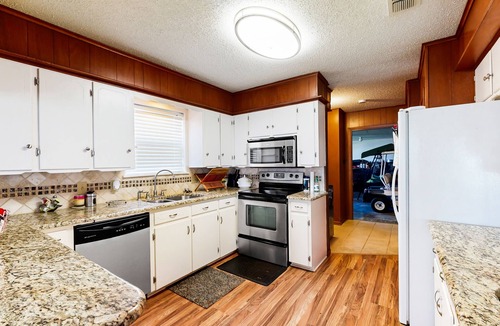 Kemp House | Lakefront retreat near golf course with serene wraparound deck, fireplace, & AC
