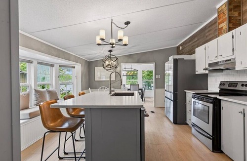 Enchanted Oaks House | Lakefront Retreat w Private Dock, Sandy Beachfront, Kayaks, Firepit & Lilypad