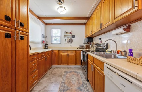 Ingles House | Lakefront retreat with private dock, open living, fire pit, full kitchen & cozy indoor spaces
