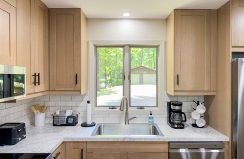 Iron River Cabin | Lakefront Stay w/Direct Snowmobile Trail Access