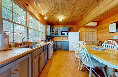 The Bays Cabin | Lakeside home with private dock, firepit, grill, scenic balcony, fireplace & AC
