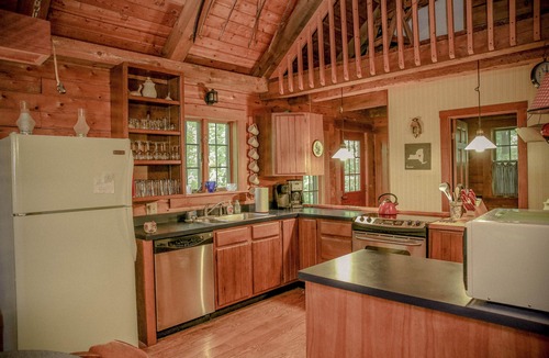 Town of Torrey Cabin | Lakeside Log Cabin with cozy stone fireplace