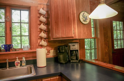 Town of Torrey Cabin | Lakeside Log Cabin with cozy stone fireplace