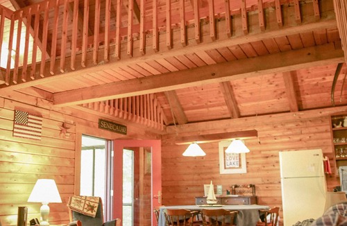 Town of Torrey Cabin | Lakeside Log Cabin with cozy stone fireplace