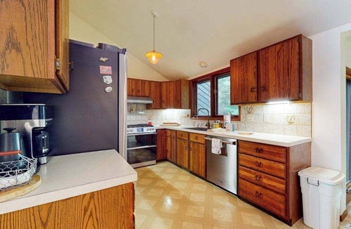 Eveline Township House | Lakeside luxury Home, dock, firepit, near town!