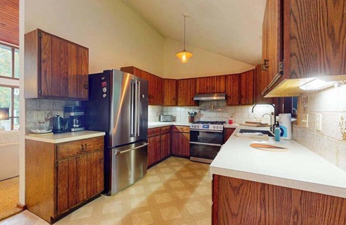 Eveline Township House | Lakeside luxury Home, dock, firepit, near town!