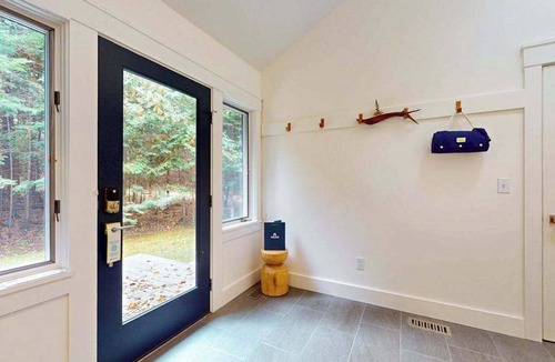 Eveline Township House | Lakeside luxury Home, dock, firepit, near town!