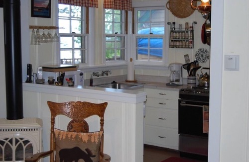 Coffeyville Cottage | Lakeview cottage-steps to beach -shared Lakefront deck! Dog ok