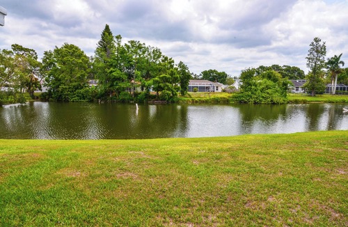 Trailer Estates Cottage | Lanai & Pond at Tranquil Bradenton Retreat!
