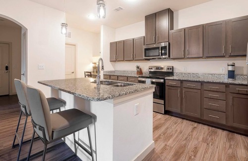 Buda Apartment | Landing | Modern 2BD, Game Room, Gym