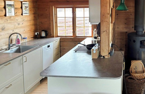 Klint House | Large log house with sea views in Klint Hills