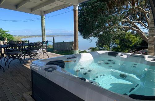 Te Kopuru Villa | Large riverfront home with spa and stage