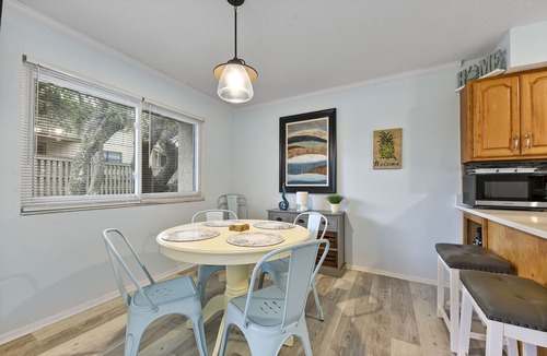 Fernandina Beach House | Latitude Adjustment-One block from the beach, shared pool, one dog allowed.