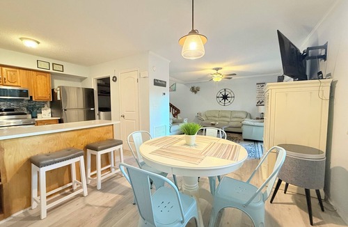 Fernandina Beach House | Latitude Adjustment-One block from the beach, shared pool, one dog allowed.