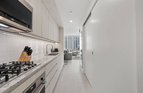 Downtown Chicago Hotel | Level - Fulton Market Junior Two Bedroom Two Bath suite with kitchen and balcony
