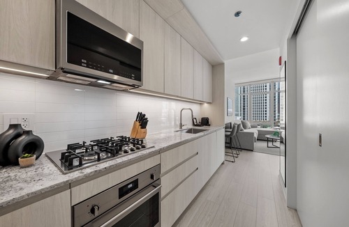 Downtown Chicago Hotel | Level - Fulton Market Junior Two Bedroom Two Bath suite with kitchen and balcony