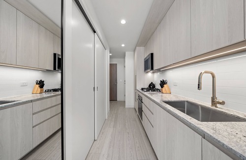 Downtown Chicago Hotel | Level - Fulton Market Junior Two Bedroom Two Bath suite with kitchen and balcony