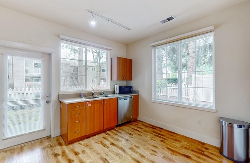 Education Hill House | Light-filled corner townhome with deck, home office & convenient location