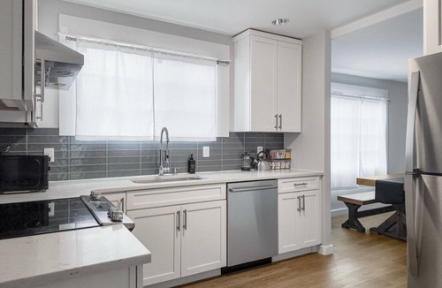 Harrison/Denny-Blaine House | Light-filled Seattle home featuring modern comforts and a tranquil fountain