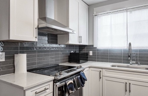 Harrison/Denny-Blaine House | Light-filled Seattle home featuring modern comforts and a tranquil fountain