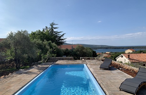 Kornic House | Lily mediterranean apartments with a sea view & heated shared pool