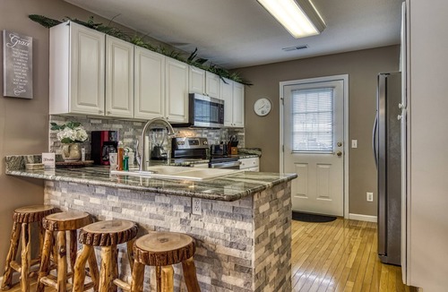 Pigeon Forge Ski Chalet | LITTLE PIGEON RIVER ACCESS-1 Mile to Pigeon Forge-Game room-Theatre system-Hot Tub and more