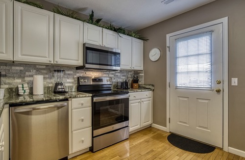 Pigeon Forge Ski Chalet | LITTLE PIGEON RIVER ACCESS-1 Mile to Pigeon Forge-Game room-Theatre system-Hot Tub and more