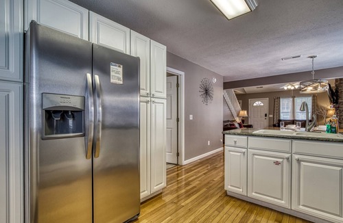 Pigeon Forge Ski Chalet | LITTLE PIGEON RIVER ACCESS-1 Mile to Pigeon Forge-Game room-Theatre system-Hot Tub and more