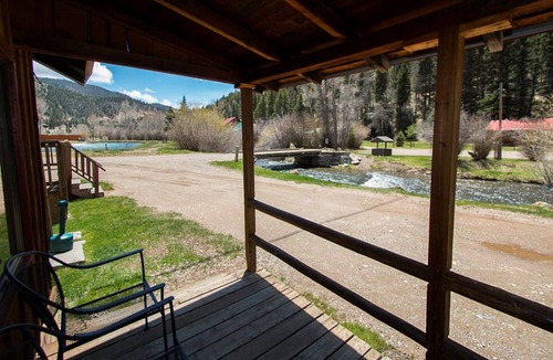 Red River Cabin | Located by the River facing the Mountains