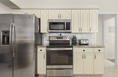 Punta Gorda House | LOCATION! Modern waterfront home;1-block to FishermanVillage; HEATED SALT POOL