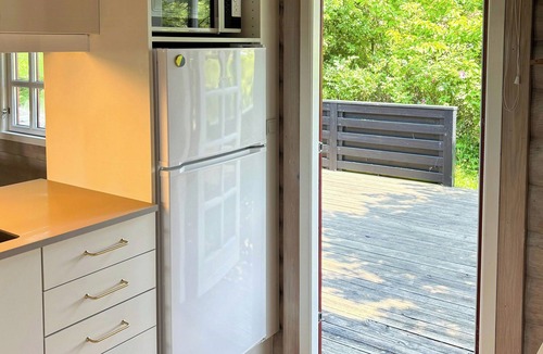 Tranekaer House | Log cabin in the front row overlooking the sea