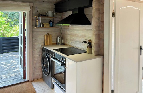 Tranekaer House | Log cabin in the front row overlooking the sea